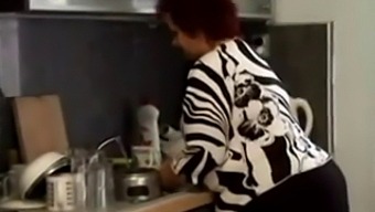 Voluptuous Granny Gets Naughty In The Kitchen