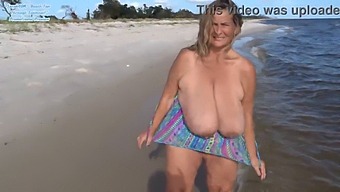 Mature Beauty Showcases Her Curves On The Beach